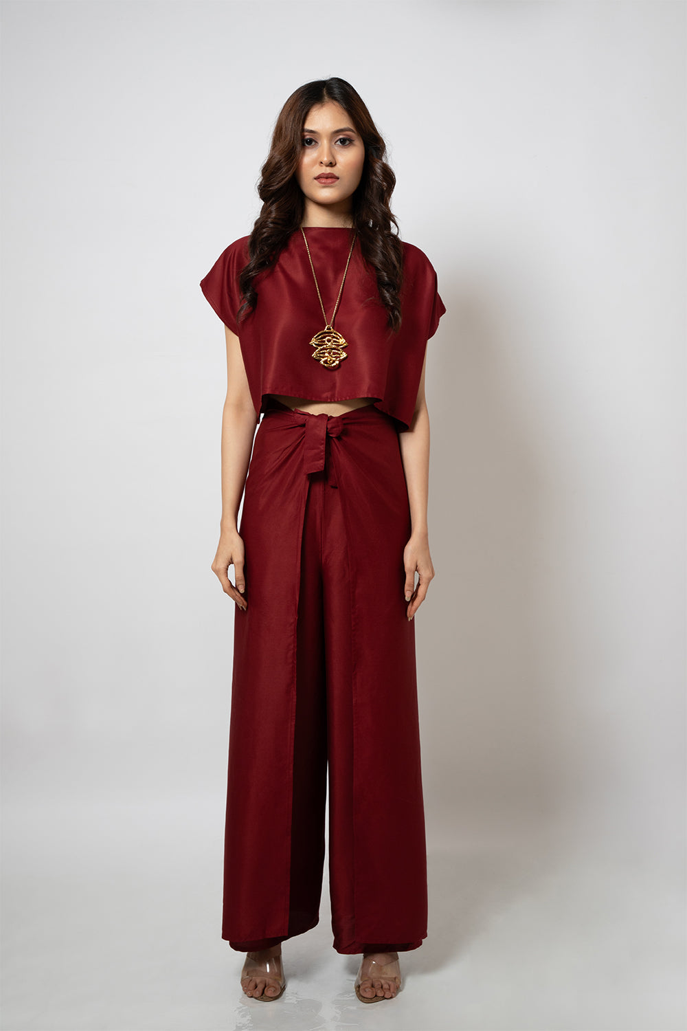 A zero waste red cotton blend crop top and pants co-ord set