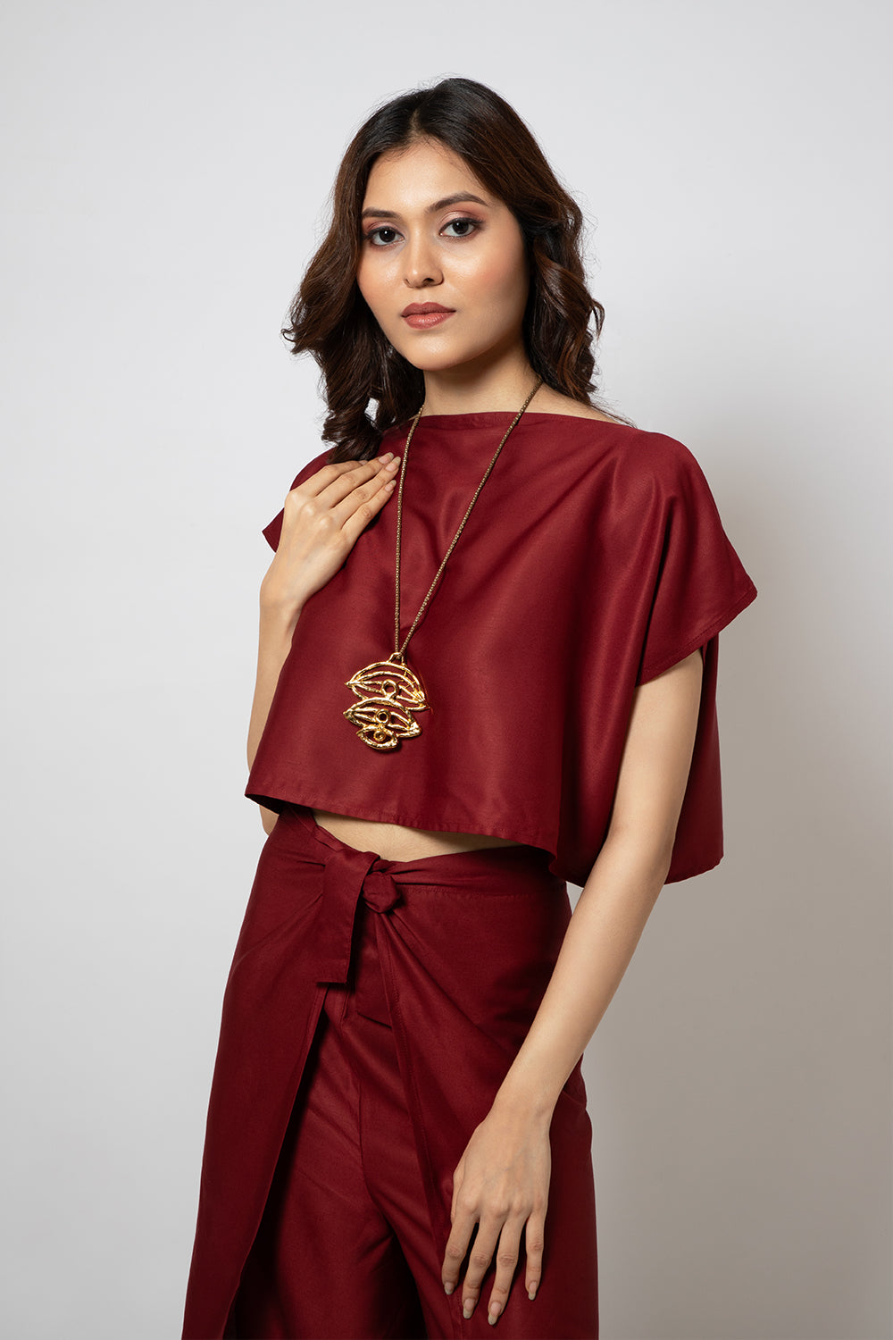 A zero waste red cotton blend crop top and pants co-ord set