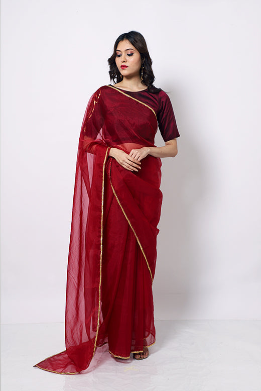 Organza Saree with gotapatti border and silk blouse hand painted with artwork inspired from Indian art