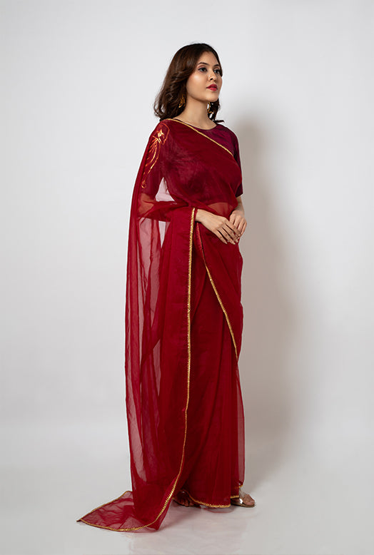 Organza Saree with gotapatti border and silk blouse hand painted with artwork inspired from Indian art