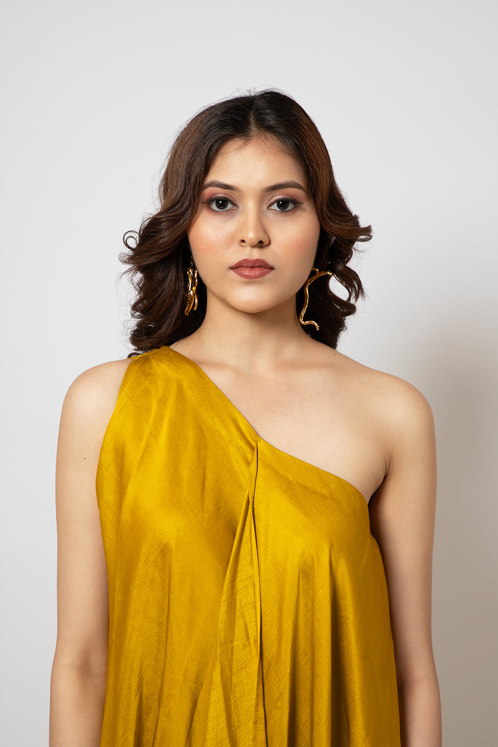 2. A zero waste one shoulder mustard yellow dress Emotive