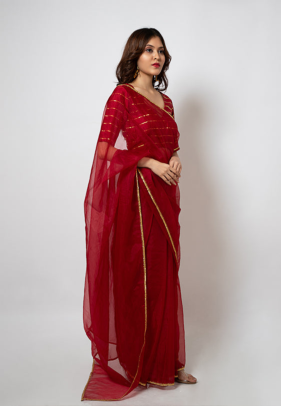 Organza Saree with gotapatti border and gold stripes silk blouse