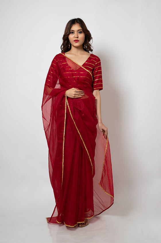 Organza Saree with gotapatti border and gold stripes silk blouse