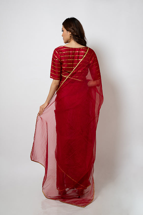 Organza Saree with gotapatti border and gold stripes silk blouse